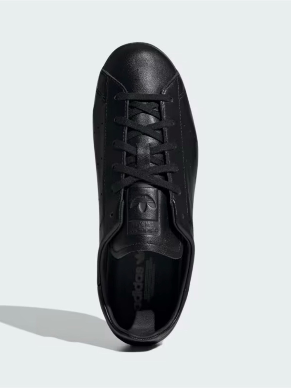 Women’s Adidas leather minimal sneaker